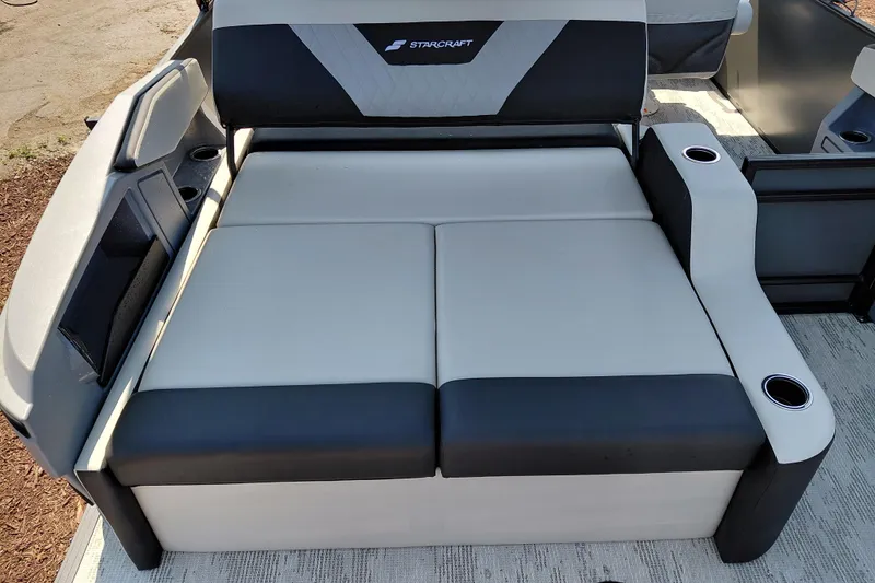 Slide: The Image of 2026 Starcraft VX 24 Q DH boat seating with cup holders and modern design. - 27