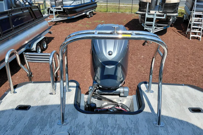 Slide: The Image of 2026 Starcraft VX 24 Q DH boat with outboard motor, displayed outdoors. - 29