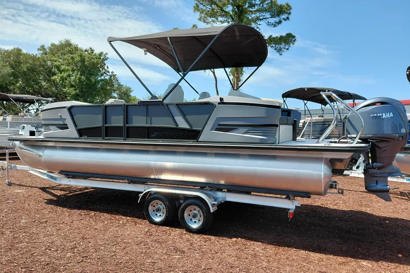 Slide: The Image of 2026 Starcraft VX 24 Q DH pontoon boat on trailer, featuring Yamaha outboard motor. - 3