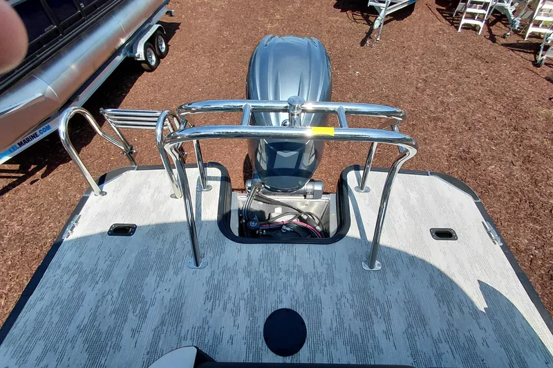 Slide: The Image of 2026 Starcraft VX 24 Q DH boat with outboard motor and safety railings. - 30