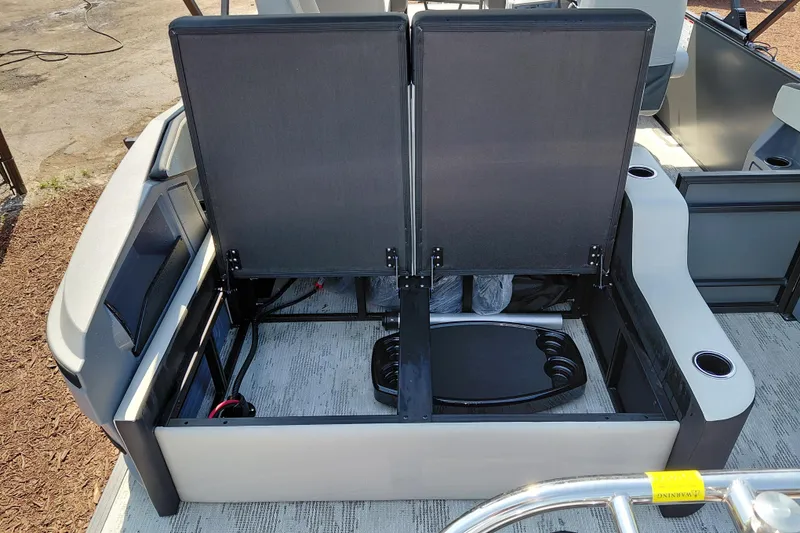 Slide: The Image of 2026 Starcraft VX 24 Q DH boat interior with seating and storage compartments. - 31