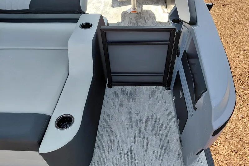 Slide: The Image of 2026 Starcraft VX 24 Q DH boat interior with seating and storage compartments. - 32