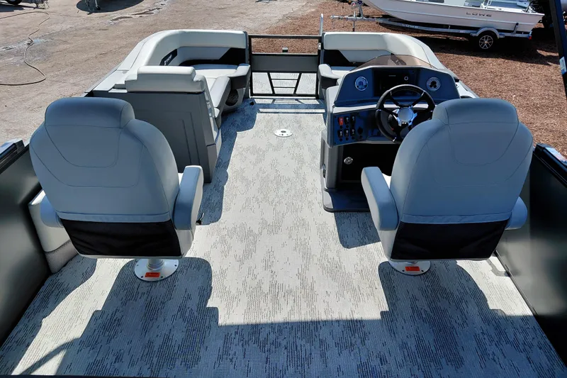 Slide: The Image of Interior of 2026 Starcraft VX 24 Q DH boat with modern seating and steering console. - 34