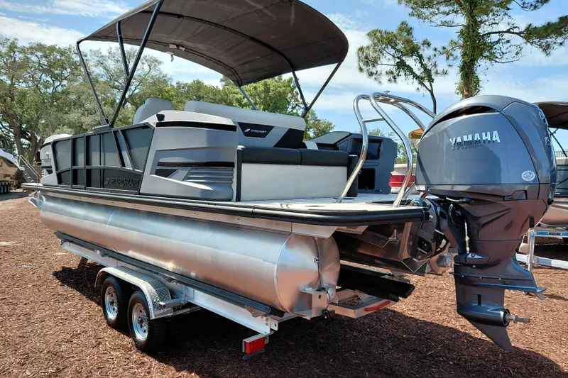 Slide: The Image of 2026 Starcraft VX 24 Q DH pontoon boat with Yamaha engine on trailer. - 4