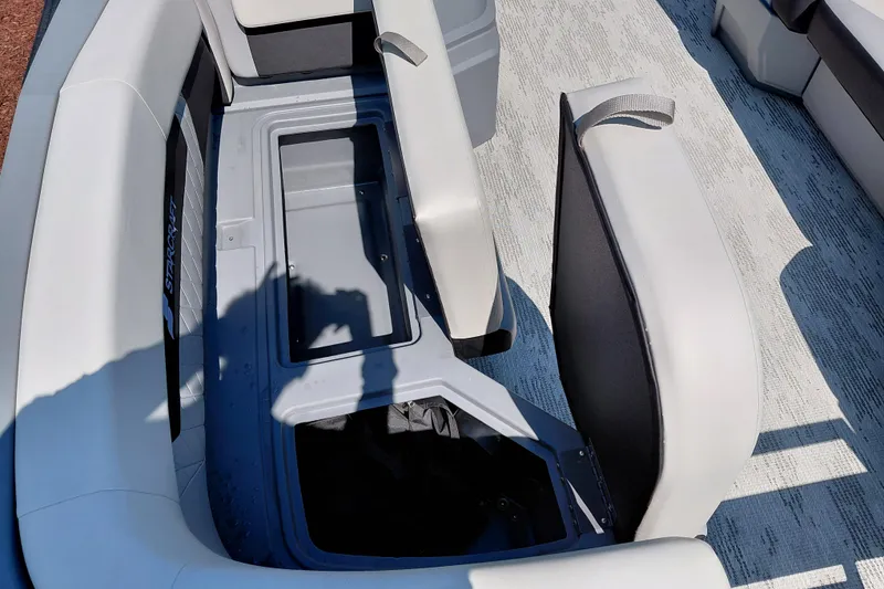 Slide: The Image of Starcraft VX 24 Q DH 2026 boat interior with open storage compartment. - 41