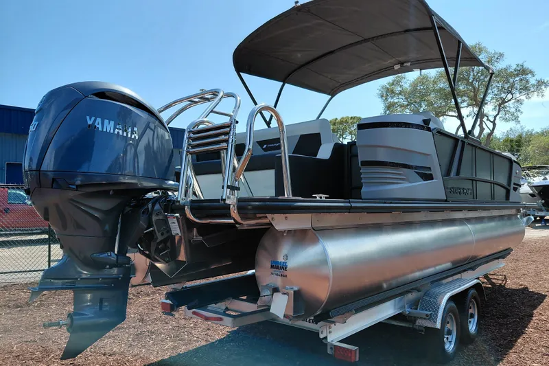 Slide: The Image of 2026 Starcraft VX 24 Q DH pontoon boat with Yamaha engine on trailer. - 7