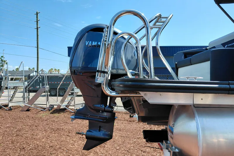 Slide: The Image of 2026 Starcraft VX 24 Q DH boat with Yamaha outboard motor, docked outdoors. - 8