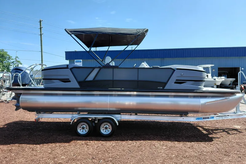 Slide: The Image of 2026 Starcraft VX 24 Q DH pontoon boat on trailer, outdoor display. - 9