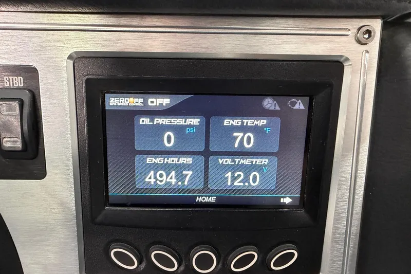 Slide: The Image of Dashboard display of a 2017 MasterCraft NXT22 showing engine metrics and controls. - 12