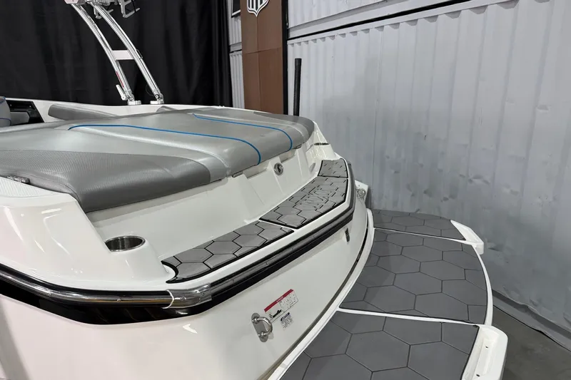 Slide: The Image of 2017 MasterCraft NXT22 boat with gray seating and hexagonal deck padding. - 5