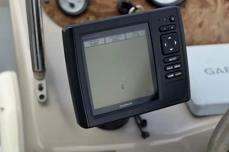 Slide: The Image of Garmin GPS device on 2000 Bayliner 2150 Capri boat dashboard, displaying navigation data. - 22