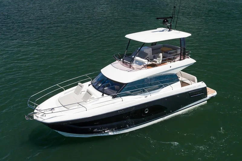 The Image of 2021 Prestige 420 yacht cruising on calm waters. - 0