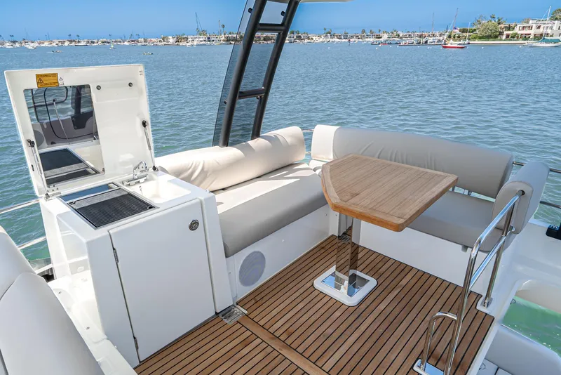 Slide: The Image of Prestige 420 Yacht 2021 with elegant seating area and sea view. - 4