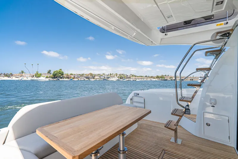 Slide: The Image of Prestige 420 Yacht 2021 with deck view and ocean scenery. - 6