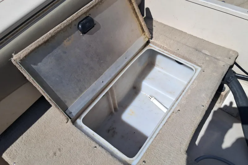 Slide: The Image of Open storage compartment on a 2002 Crestliner 1850 Sportfish boat. - 8