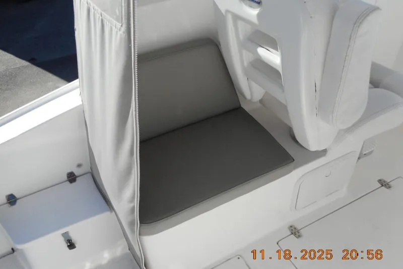 Slide: The Image of Interior seating of a 2021 NorthCoast 235 HT boat, featuring gray cushions. - 6
