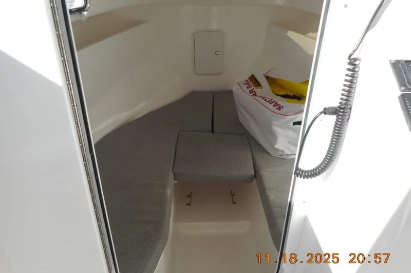 Slide: The Image of Interior cabin of 2021 NorthCoast 235 HT boat with safety gear bag. - 7
