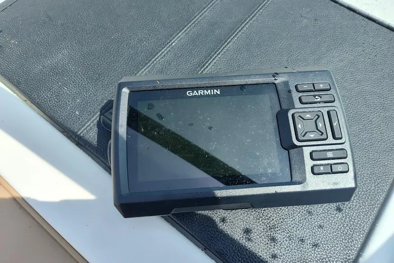 Slide: The Image of Garmin GPS device on 2023 Sea Ray SPX 190 boat dashboard. - 11