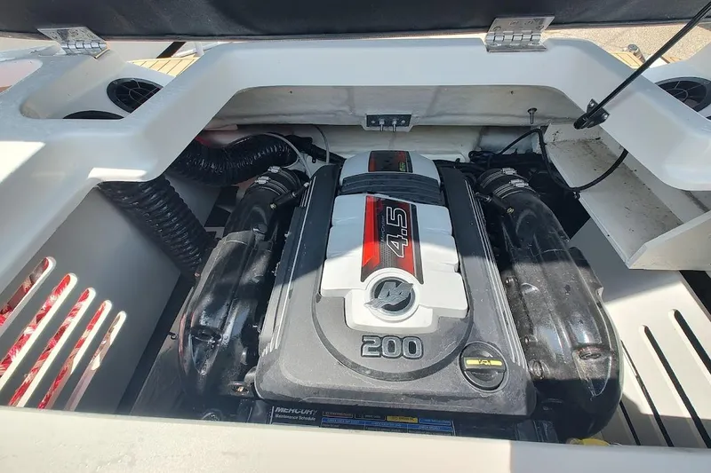 Slide: The Image of Engine compartment of 2023 Sea Ray SPX 190 boat, featuring a 4.5L 200 HP engine. - 18