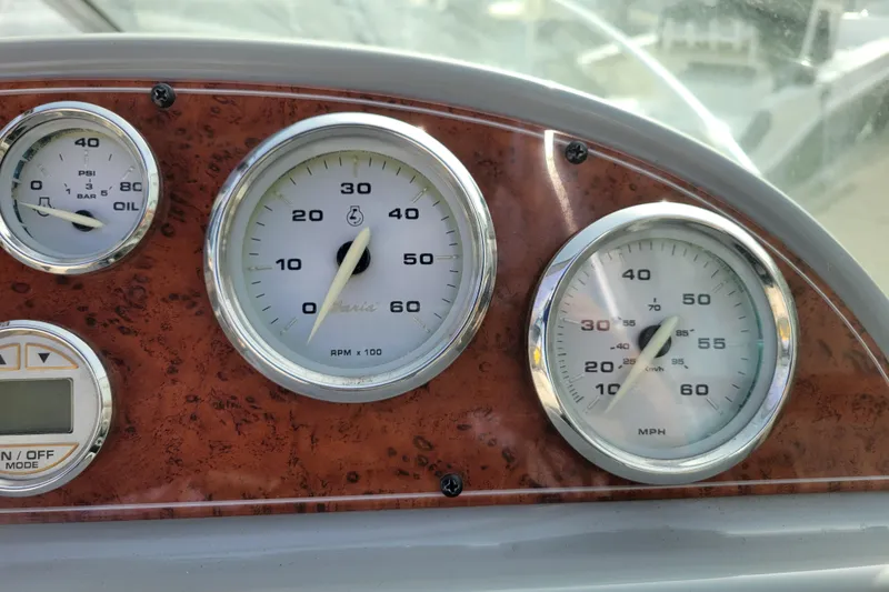 Slide: The Image of Dashboard of a 2007 Bayliner 245 Cruiser showing gauges for RPM, speed, and oil pressure. - 17