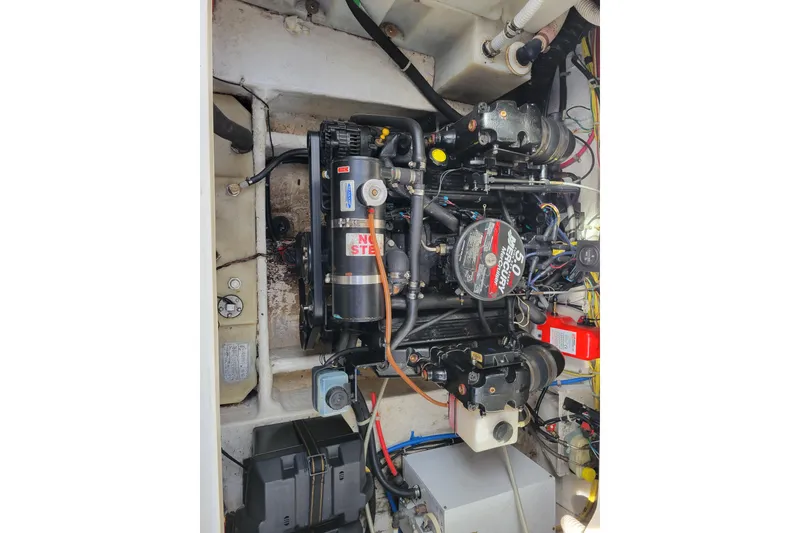Slide: The Image of Engine compartment of a 2007 Bayliner 245 Cruiser, featuring a Mercury 5.0L motor. - 18