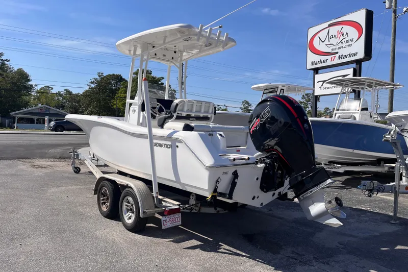 Slide: The Image of 2022 Tidewater 210 LXF boat on trailer at Marker 17 Marine dealership. - 2