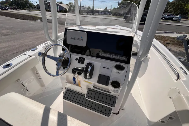Slide: The Image of 2022 Tidewater 210 LXF boat console with Garmin navigation system and steering wheel. - 7