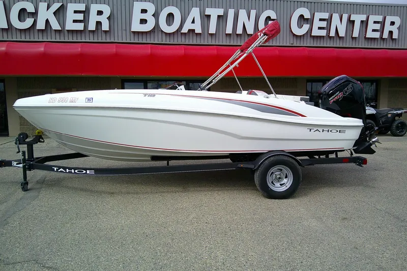 The Image of 2024 Tahoe T18 boat on trailer at a boating center. - 0