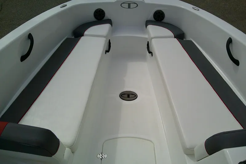 Slide: The Image of 2024 Tahoe T18 boat interior with white and gray seating, featuring red accents. - 10