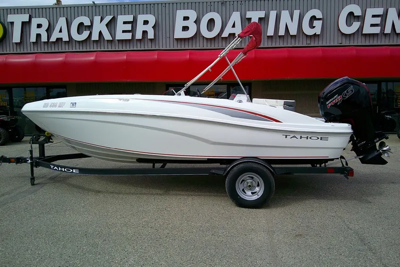 Slide: The Image of 2024 Tahoe T18 boat on trailer at Tracker Boating Center. - 2