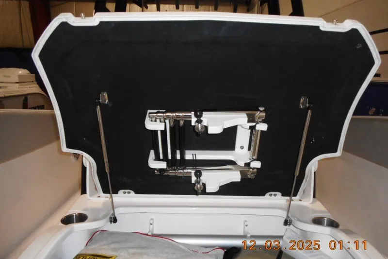 Slide: The Image of 2023 Sea Fox 288 Commander boat storage compartment with open lid and hydraulic supports. - 12