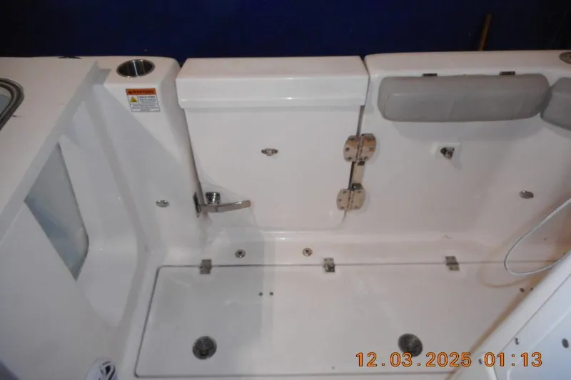 Slide: The Image of Interior view of 2023 Sea Fox 288 Commander boat, featuring seating and storage compartments. - 16