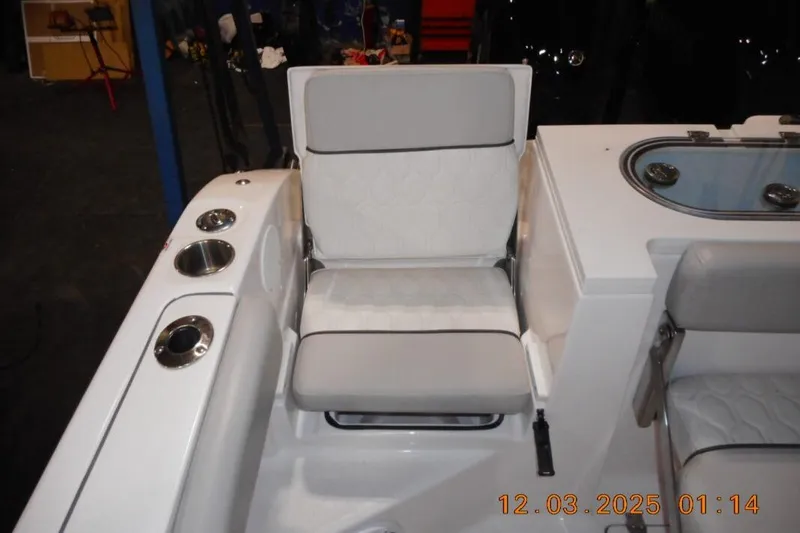 Slide: The Image of 2023 Sea Fox 288 Commander boat seating with cup holders and storage. - 18