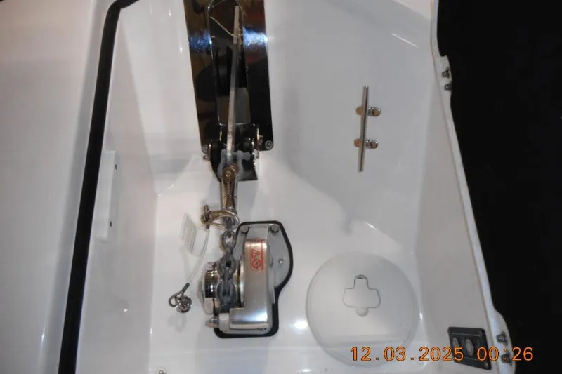 Slide: The Image of Anchor compartment of 2023 Sea Fox 288 Commander boat, featuring winch and cleat. - 5