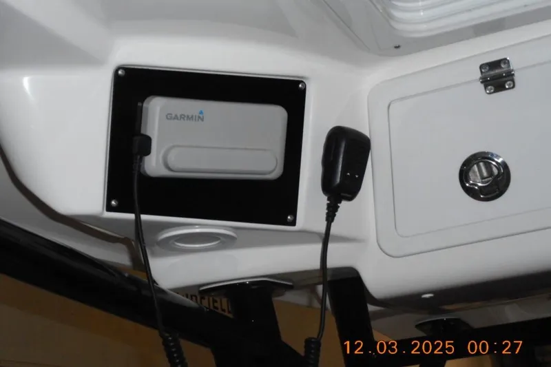 Slide: The Image of Interior of 2023 Sea Fox 288 Commander featuring Garmin device and microphone. - 8