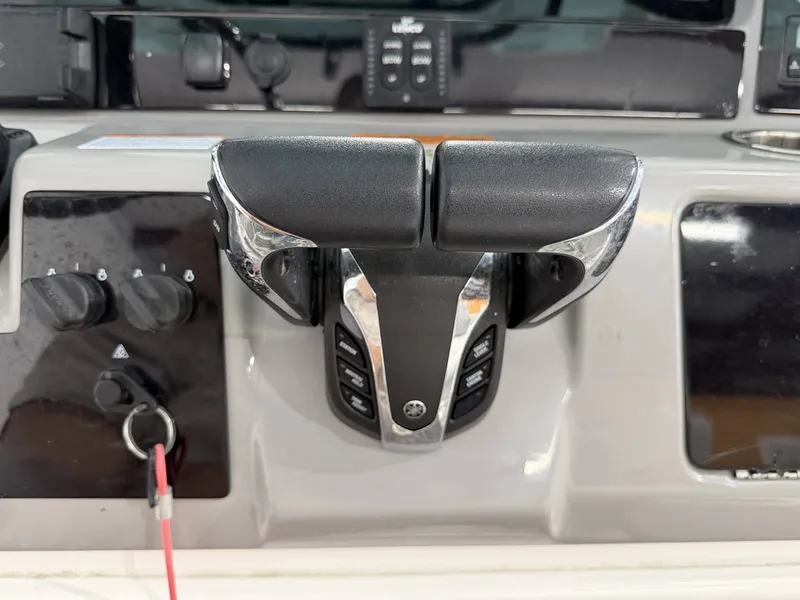 Slide: The Image of 2023 Robalo R250 center console with controls. - 26