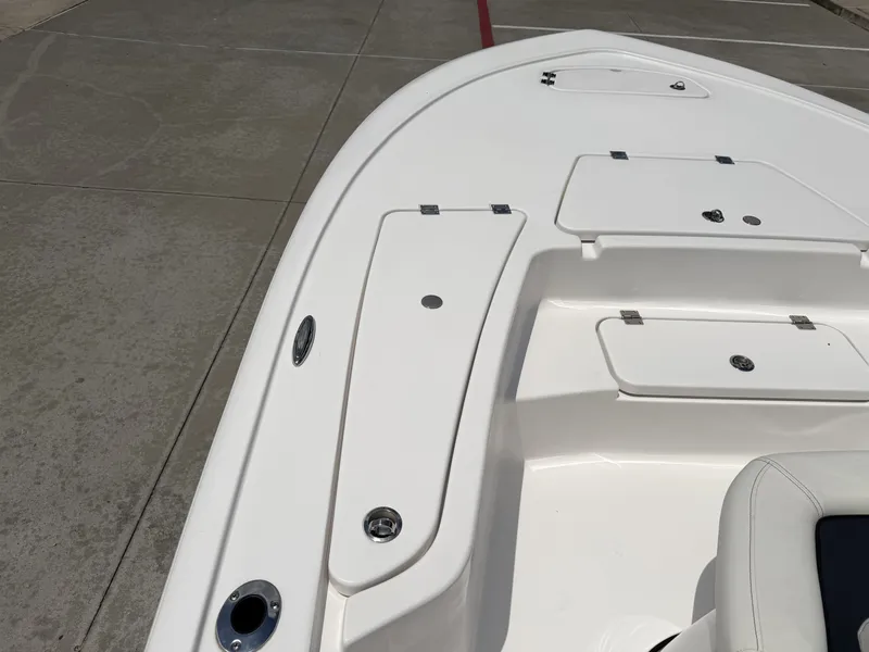 Slide: The Image of Bow deck of 2026 Tidewater 2110BMT boat with storage compartments. - 18