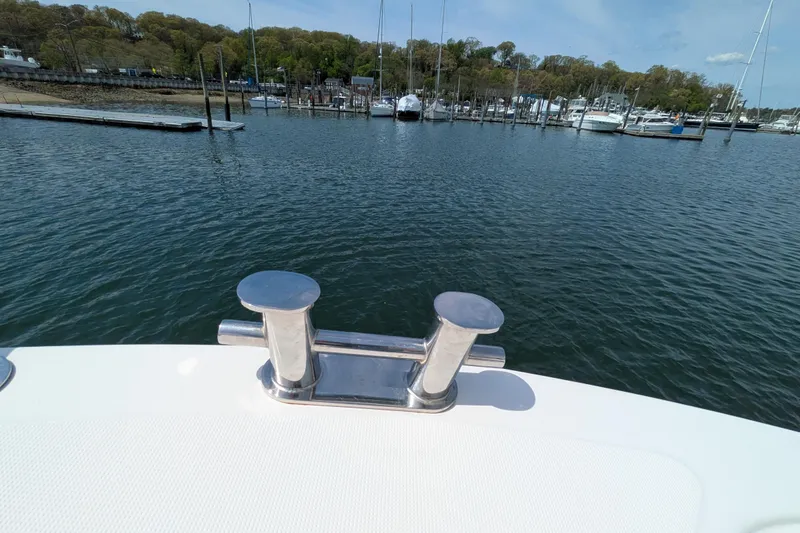 Slide: The Image of American Tug 41 (2005) boat cleat with marina view in the background. - 13