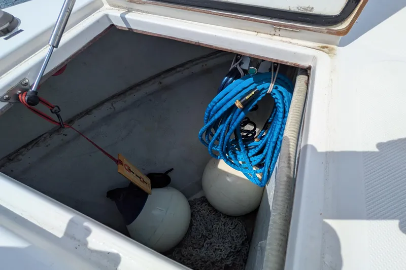 Slide: The Image of Storage compartment on a 2005 American Tug 41 with ropes and fenders. - 14