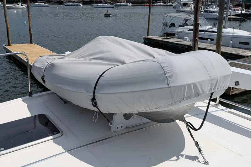 Slide: The Image of Covered dinghy on 2005 American Tug 41 yacht deck at marina. - 20