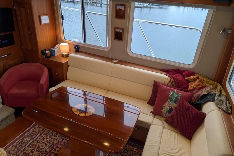 Slide: The Image of Cozy interior of 2005 American Tug 41 with plush seating and decorative pillows. - 33