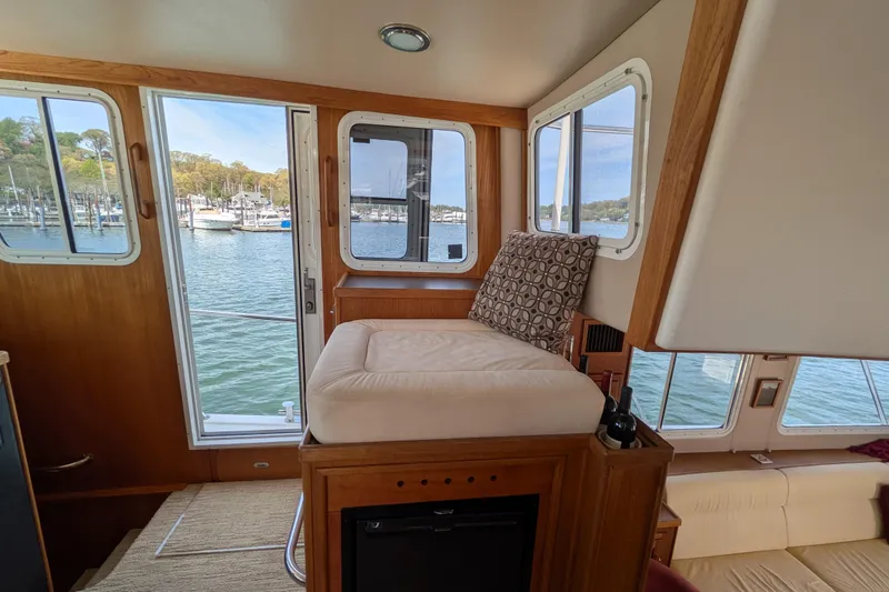 Slide: The Image of Interior of 2005 American Tug 41 with scenic marina view through windows. - 44