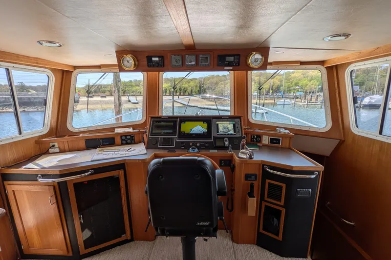Slide: The Image of Pilothouse of 2005 American Tug 41 with navigation equipment and panoramic windows. - 50