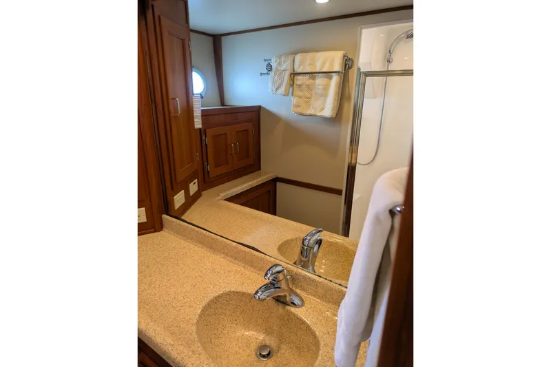 Slide: The Image of Bathroom interior of 2005 American Tug 41 with sink, mirror, and shower. - 71