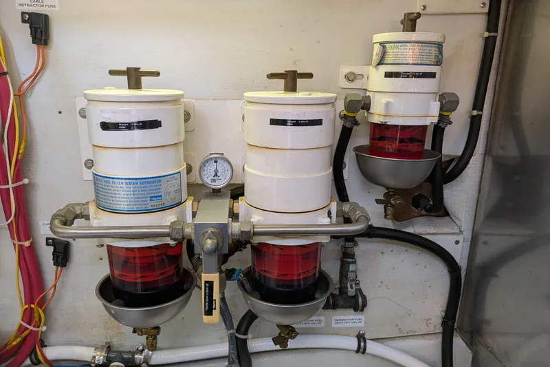Slide: The Image of Engine room of 2005 American Tug 41 with fuel filter system and gauge. - 74