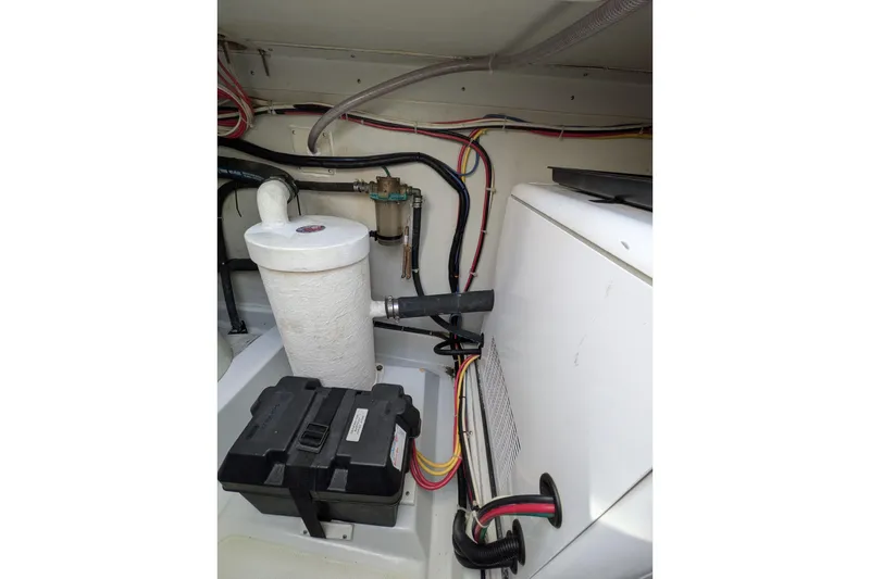 Slide: The Image of Engine compartment of a 2005 American Tug 41, featuring wiring and components. - 87