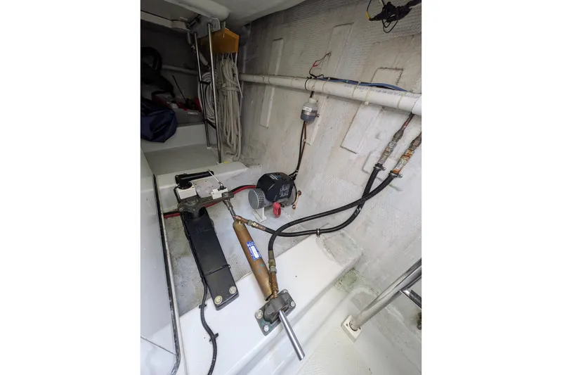 Slide: The Image of Engine room of 2005 American Tug 41 with mechanical components and wiring. - 89