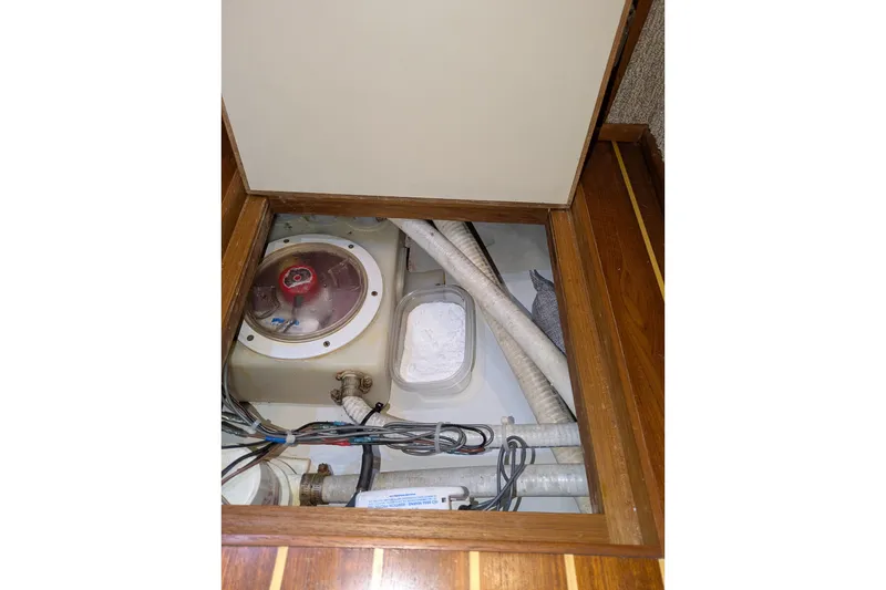 Slide: The Image of Engine compartment of a 2005 American Tug 41, showing wiring and hoses. - 91