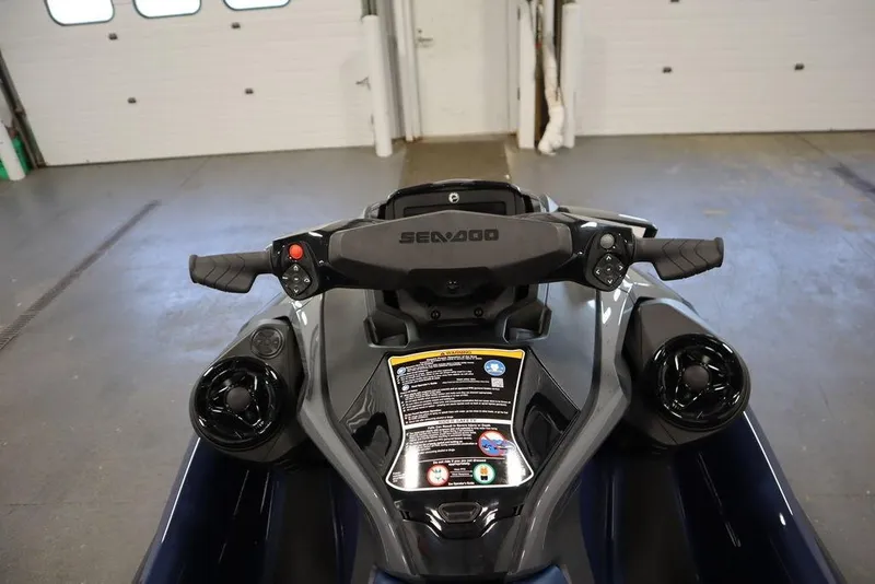 Slide: The Image of 2026 Sea-Doo GTX 170 handlebars and dashboard in a garage setting. - 12