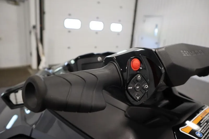 Slide: The Image of Close-up of 2026 Sea-Doo GTX 170 handlebar controls in a garage setting. - 21